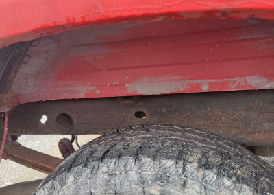 red pickup truck wheel arch rear